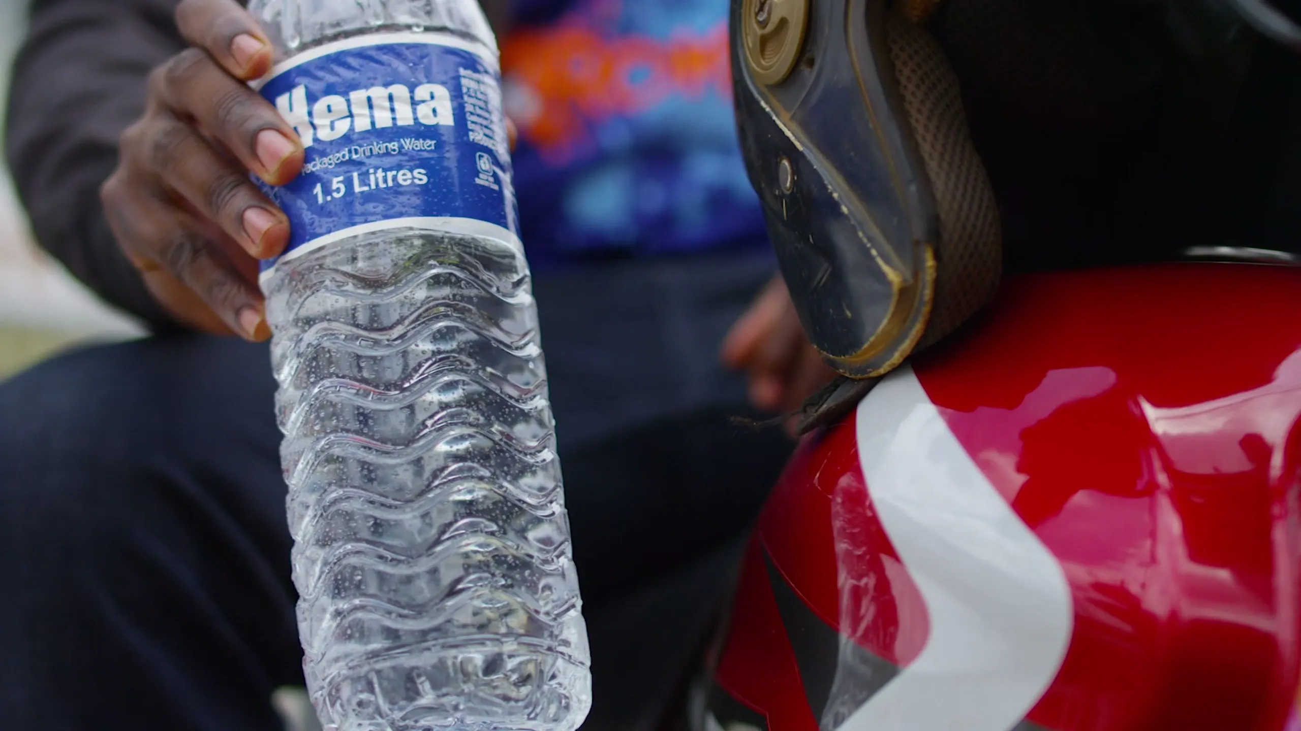 A HEMA bottle with a customer in Uganda